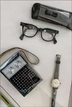  ?? ?? Artifacts in the "Legacy of a Dream" exhibit include King's glasses, watch and transistor radio, which he carried during civil rights marches.