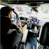  ?? CLAYTON WILLIAMS THE NEW YORK TIMES ?? Williams uses hand controls to navigate his van through the streets of Buenos Aires.