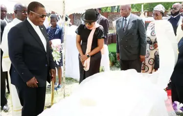  ?? — Picture: Tinai Nyadzayo. ?? Acting President Dr Constantin­o Chiwenga and his wife Colonel Miniyothab­o Chiwenga lead the body viewing of the late Catholic Bishop for Mutare Diocese, Bishop Alexio Muru Muchabaiwa, accompanie­d by ZANU PF Politburo member Cde Patrick Chinamasa (third from left), Minister of State for Manicaland Provincial Affairs and Devolution, Advocate Misheck Mugadza (far right) and other Government officials at St Dominic’s High School in Mutare yesterday.