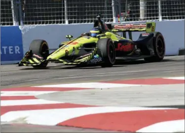  ?? JASON BEHNKEN — THE ASSOCIATED PRESS ?? Sebastien Bourdais (18) races into Turn 10before winning the IndyCar Firestone Grand Prix of St. Petersburg, Sunday in St. Petersburg, Fla.