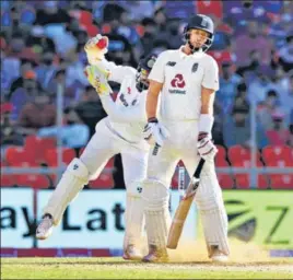  ?? BCCI ?? India keeper Rishabh Pant gathers an Axar Patel delivery that surprised Joe Root by kicking up from length on Day 2 of the third Test in Ahmedabad.