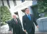  ?? WIN MCNAMEE VIA AFP ?? Paul Manafort (right), former campaign manager for US President Donald Trump, leaves US District Court in Washington on Monday.