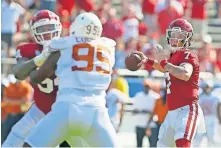  ?? OKLAHOMAN] ?? Spencer Rattler (7) drops back to pass during the Sooners' 53-45 win over Texas in four overtimes Oct. 10 in Dallas. [BRYAN TERRY/ THE