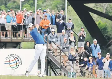  ??  ?? Jason Day of Australia plays his tee shot at the 13th hole against Rory McIlroy of Northern Ireland during the semifinal round of the World Golf Championsh­ips-Dell Match Play at the Austin Country Club in Austin, Texas. — AFP photo