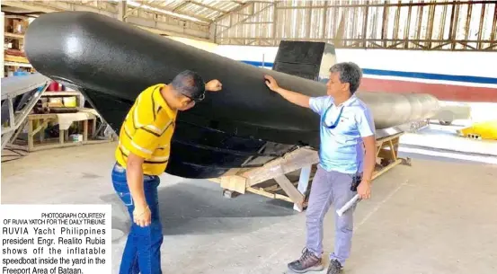  ?? PHOTOGRAPH COURTESY OF RUVIA YATCH FOR THE DAILY TRIBUNE ?? RUVIA Yacht Philippine­s president Engr. Realito Rubia shows off the inflatable speedboat inside the yard in the Freeport Area of Bataan.