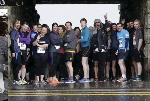  ??  ?? ABOVE: Runners take shelter from a downpour. LEFT: Olivia Kerrigan. FAR LEFT: Eilis O’Driscoll at the front of the third wave.