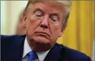  ?? (AP/Evan Vucci) ?? President Donald Trump listens Wednesday during an Oval Office event held in honor of World Nurses Day.