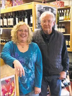  ?? Deborah Rose / Hearst Connecticu­t Media ?? Jeff and Dolly Bellamy of New Milford are closing their business, Dolly’s Wine Boutique on Railroad Street in New Milford.