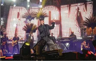  ?? Jon Shapley / Staff photograph­er ?? Ricky Martin performs at the Houston Livestock Show and Rodeo on Friday at NRG Stadium, where 56,781 in attendance could shake their bon bon along.