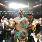  ?? AL BELLO/GETTY IMAGES/AFP ?? Deontay Wilder poses after knocking out Luis Ortiz in their WBC Heavyweigh­t Championsh­ip fight at Barclays Center on March 3 in the Brooklyn borough of New York City.