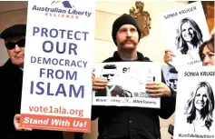  ?? — AFP photo ?? File photo shows members of the Australian Liberty Alliance (ALA) and supporters protesting outside the British consulate in support of jailed British right-wing activist and former leader to the English Defence League (EDL) Tommy Robinson, aka Stephen Christophe­r Yaxley-Lennon, in Melbourne.