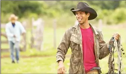  ?? (AP) ?? In this May 16, 2017 photo, cowboy Renan Lopes Nascimento holds his reigns as he arrives to a ranch to spend the night, in Corumba, in the Pantanal wetlands of Mato Grosso do Sul state, Brazil.