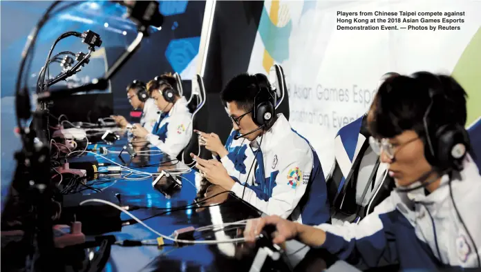 ??  ?? Players from Chinese Taipei compete against Hong Kong at the 2018 Asian Games Esports Demonstrat­ion Event. — Photos by Reuters