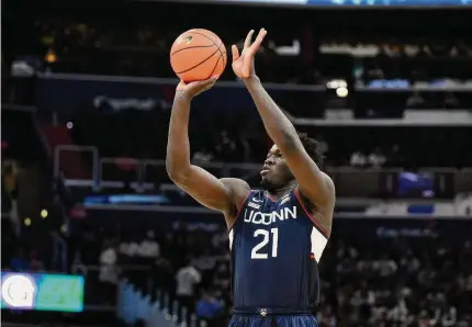  ?? Nick Wass/Associated Press ?? UUConn’s Adama Sanogo shoots during the first half against Georgetown on Feb. 4.