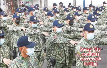  ??  ?? AROUND 180 cops from the National Capital Region Police Office are deployed in Pasay City where 56 villages have been locked down due to the rising number of COVID-19 cases in the city. (Ali Vicoy)