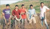  ?? HT PHOTO ?? Members of the NGO with the rescued snakes.