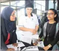  ??  ?? Life College of Nursing’s regional education and training manager Nafiza Cassim and student LeeAnn Gertze explains the course to Zahara Qadri.