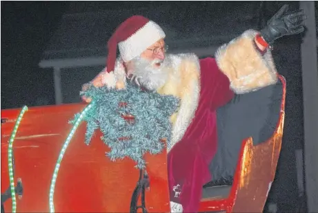  ?? KEVIN ADSHADE/THE NEWS ?? Santa Claus was the star attraction of the annual Parade of Lights, which took place in Westville on Dec. 1