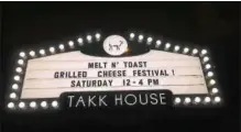  ?? PHOTO PROVIDED ?? A sign for Melt N’ Toast is lit up outside Takk House in downtown Troy.