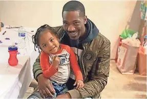  ?? CARLOS ATKINS ?? “I just hope and pray for the best,” says Detroit father Carlos Atkins on sending his 2-year-old son back to day care when Michigan reopens.