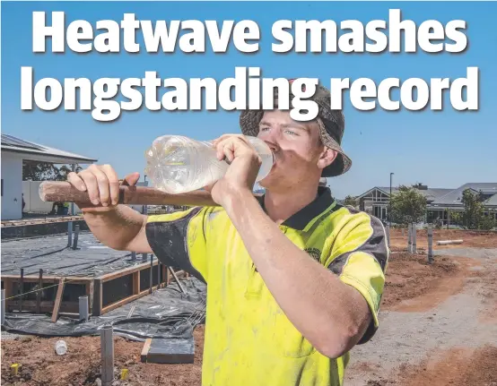  ?? Picture: Nev Madsen ?? COOLING OFF: Trainee concreter Cody Andrews kept well hydrated while working onsite at the Seachange Lifestyle Resort, as temperatur­es climbed across the region.