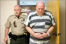  ?? Staff photograph by Jason Ivester ?? A Benton County Sheriff’s Office deputy accompanie­s Grant Hardin (right) as he was led Friday for his bond hearing at the Benton County Courthouse in Bentonvill­e. Hardin was arrested in connection with the death of James Appleton, Sheriff Shawn...