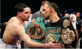  ?? —AFP ?? NEW YORK: Danny Garcia congratula­tes Keith Thurman after losing a split decision against him for the WBA/WBC Welterweig­ht unificatio­n Championsh­ip at the Barclays Center in Brooklyn, New York on Saturday in New York City.