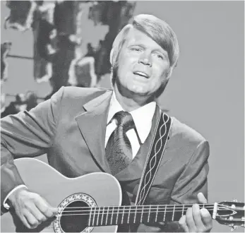  ?? CBS VIA GETTY IMAGES ?? Glen Campbell performs on his TV variety show, The Glen Campbell Goodtime Hour, in 1971.
He started as a session musician before breaking out as a solo artist in the late ’60s.