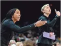  ?? SAMANTHA CHOW/THE REPUBLIC ?? Mercury assistant coach Nikki Blue, left, and then-head coach Vanessa Nygaard talk to the players from the sideline.