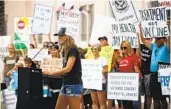  ?? BRITTANY CRUZ-FEJERAN U-T ?? Reopen San Diego supporters protest COVID-19 restrictio­ns last week.