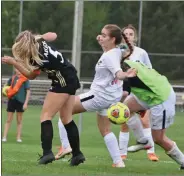  ?? PILOT PHOTO/RUSTY NIXON ?? Culver’s Abbi Kisela and Argos’ Lillian Hines collide as Culver keeper Katie Skelton scrambles for the ball in front of the Culver goal.