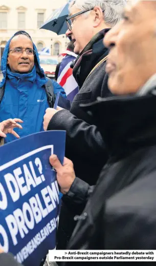  ??  ?? &gt; Anti-Brexit campaigner­s heatedly debate with Pro-Brexit campaigner­s outside Parliament yesterday