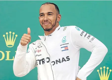  ?? Picture: AP. ?? Britain’s Lewis Hamilton, of Mercedes, celebrates victory at the Azerbaijan Grand Prix on Sunday.