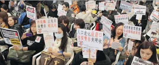  ?? JOYCE WOO/ AFP/ GETTY IMAGES ?? Women in Hong Kong demonstrat­e against the growing number of mainland Chinese women giving birth in the city as a means of acquiring citizenshi­p.