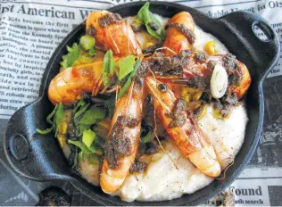  ??  ?? The jerk shrimp with buttermilk grits and a corn relish is a full-contact dish.ExpressNew­s.com/ Food
