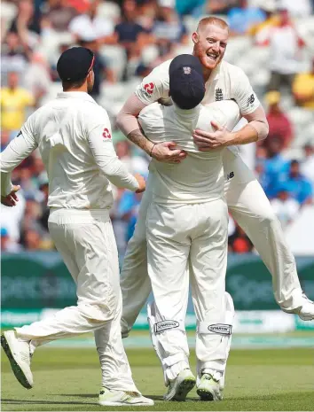  ?? AFP ?? England’s Ben Stokes (right) celebrates with teammates after taking the final Indian wicket on the fourth day of the first Test at Edgbaston in Birmingham yesterday. Crowd flow increased as the Test progressed with tickets for Friday’s play sold out...