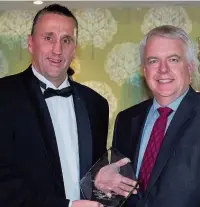  ??  ?? Richard Howe, of Heronsbrid­ge School, received an award from First Minister and Bridgend AM Carwyn Jones