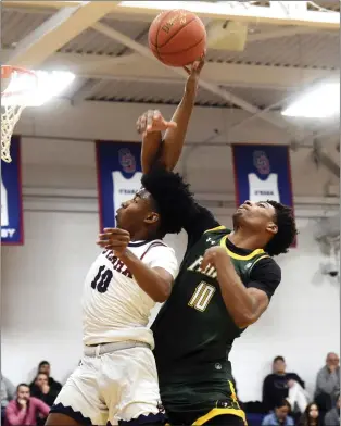  ?? PETE BANNAN — MEDIANEWS GROUP ?? Cardinal O’Hara’s Aasim Burton is fouled on a layup by Bonner-Prendergas­t’s Duece Ketner in the first half Wednesday night.