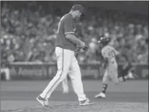  ?? CHRIS YOUNG, THE ASSOCIATED PRESS ?? Blue Jays starter Joe Biagini stands on the mound as Boston Red Sox hitter Mookie Betts rounds the bases after blasting a two-run homer in the sixth.