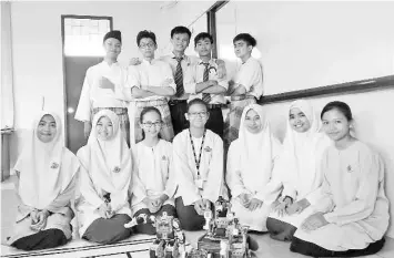  ??  ?? Maktab Rendah Sains Mara (MRSM) Kuching, Sarawak robotics team win at the Robotfair competitio­n which gathers all MRSM robotics teams in Malaysia.The winner at this level will then represent Malaysia at the World Robot Olympiad (WRO) and Internatio­nal Robot Olympiad (IRO). - Bernama photo