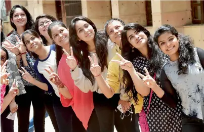  ?? PTI ?? Students celebrate their success in the CBSE Class 12th examinatio­n at their school in New Delhi on Sunday. —