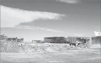  ?? STEVE MARCUS (2015) ?? A worker uses a front loader to clear debris in November 2015 from the former New Frontier casino site on Las Vegas Boulevard South. After plans for the Alon Las Vegas resort-casino project were called off recently, speculatio­n about how the site will developed commenced.