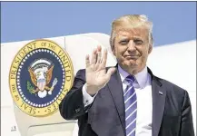  ?? PABLO MARTINEZ MONSIVAIS / AP ?? President Donald Trump waves as he arrives Wednesday in Bismark, N.D. While Trump is talking about bipartisan­ship on taxes, GOP leaders in Congress have made clear they’re pursuing a go-it-alone strategy.