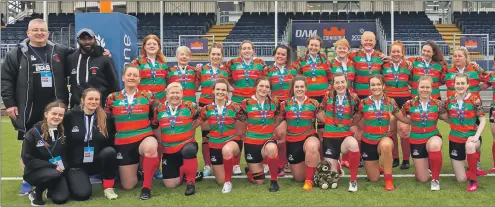  ?? Photograph: Stephen Lawson. ?? Oban Lorne Ladies with their coaches and backroom staff after the National Plate final at the DAM Health Stadium, Murrayfiel­d, on Saturday.