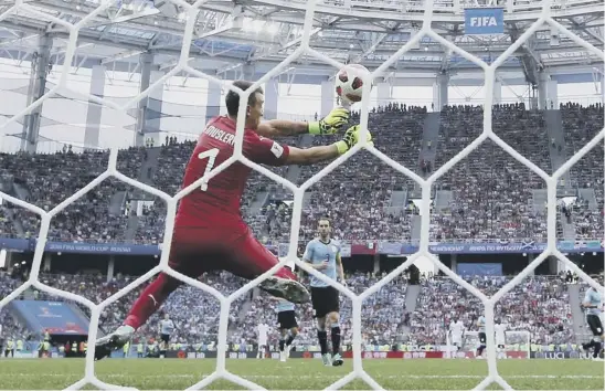  ??  ?? Uruguay goalkeeper Fernando Muslera fumbles the ball as Antoine Griezmann puts France 2-0 ahead during their quarter-final at Nizhny Novgorod Stadium.