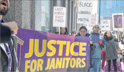  ?? CP PHOTO ?? Protesters gather outside the Founders Square building in Halifax on Monday. Seven black janitorial workers, set to lose their jobs at the end of the month when their cleaning contract ends and a new contractor takes over, were fired after indicating...