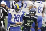  ?? SCOTT EKLUND — THE ASSOCIATED PRESS ?? Seahawks strong safety Jamal Adams (33) looks at Rams quarterbac­k Jared Goff, a former Marin Catholic standout, during the second half of their NFC wild-card game on Saturday in Seattle.