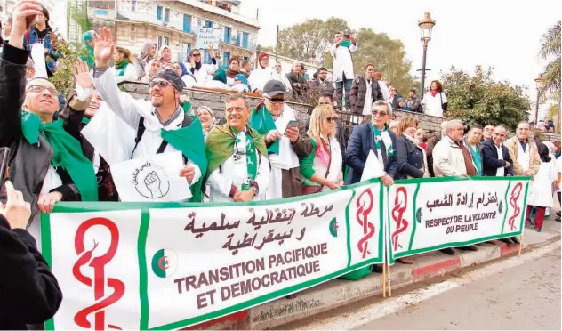  ?? Agence France-presse ?? Algerian health care profession­als protest against Abdelaziz Bouteflika in Algiers on Tuesday.