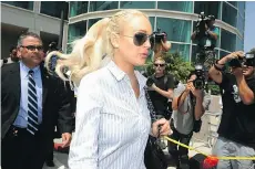  ?? ROBYN BECK/GETTY IMAGES ?? Lindsay Lohan has had many brushes with the law following success as a young Disney star.