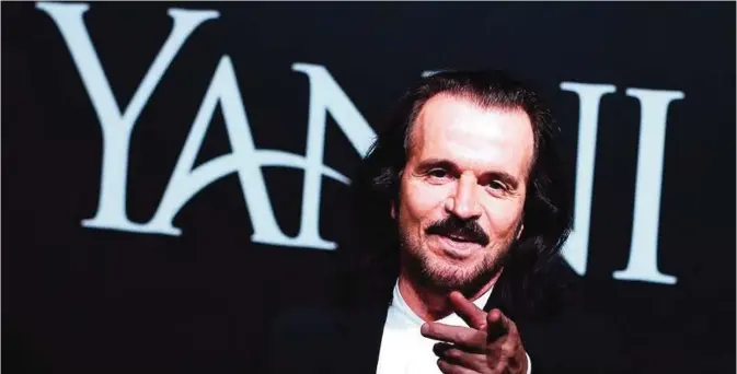  ??  ?? Greek musician Yanni poses for a photo before a press conference at Sheikh Jaber Al-Ahmad Cultural Center in Kuwait City yesterday. Yanni is set to perform two shows this weekend for the first time in the Gulf state as part of his internatio­nal tour. —...